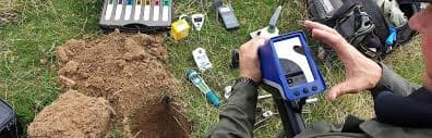 Agronomist in a field representing agricultural consultation and soil testing